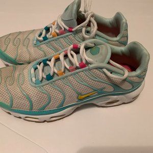 Green and white Nikes